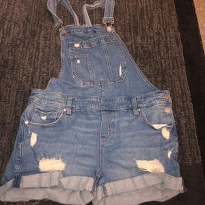 Blue ripped overalls